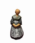Terakotowa figurka kobiety w stroju ludowym